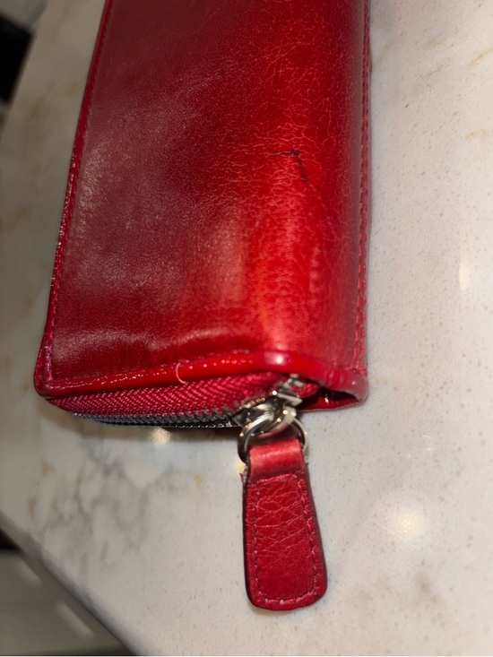 Brighton Red leather wallet featuring a decorative silver-toned snap closure. - Picture 4 of 16